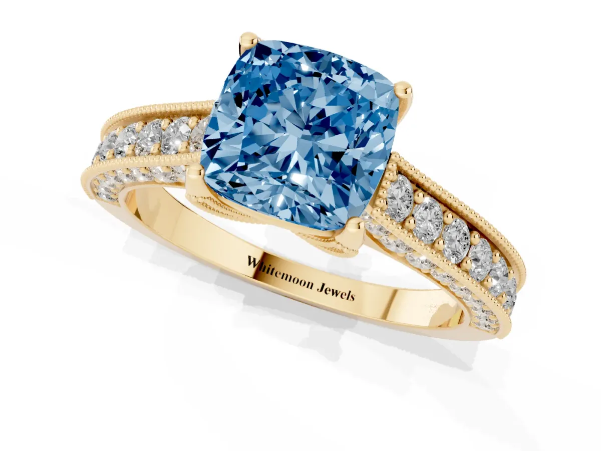 Fancy Blue Cushion Cut Cut Diamond Solitaire Ring with Milgrain Pave Band and Four Prong Setting Yellow gold