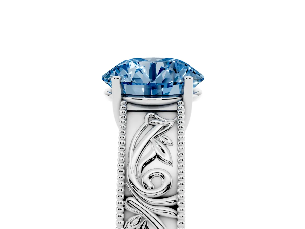 Fancy Blue Round Cut Diamond Solitaire Ring with Engraved Band and Four-Prong Setting White gold