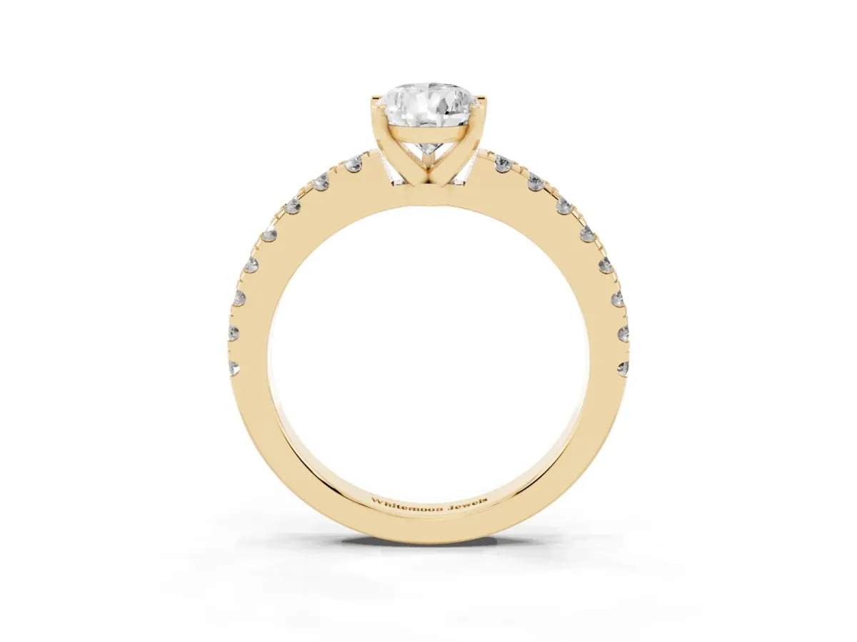 Pear Cut Solitaire Diamond with Pavé Band and Four-Prong Setting Yellow gold