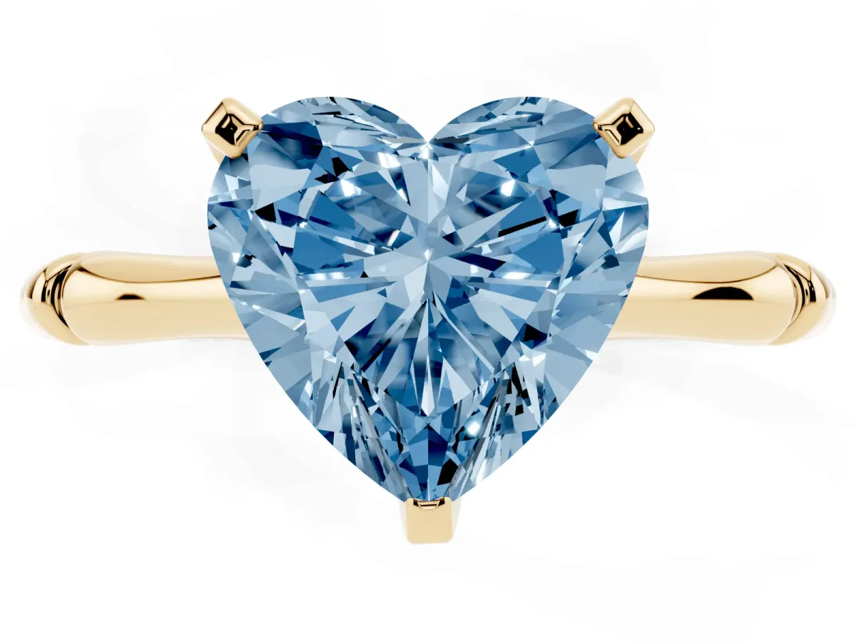 Fancy Blue Heart Cut Solitaire Diamond Ring with Bamboo Band and Four-Prong Setting Yellow gold