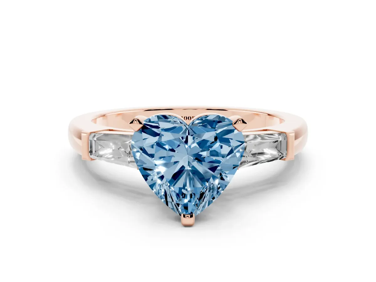 Fancy Blue Heart Cut Solitaire with Tapered Baguette Side Stones on a Classic Band with Four-Prong Setting Rose gold