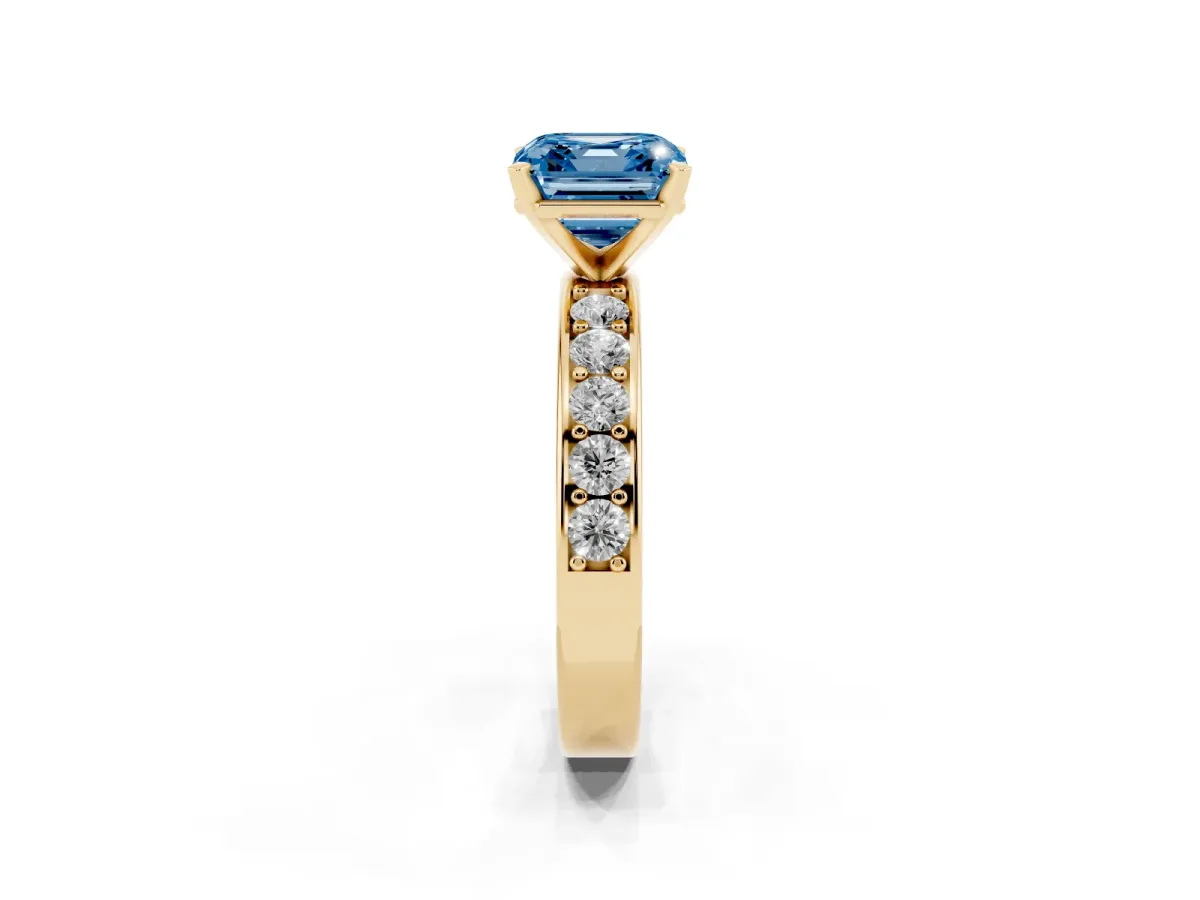 Fancy Blue Asscher Cut Diamond Engagement Ring with Channel Set Round Band and Prong Setting Yellow gold
