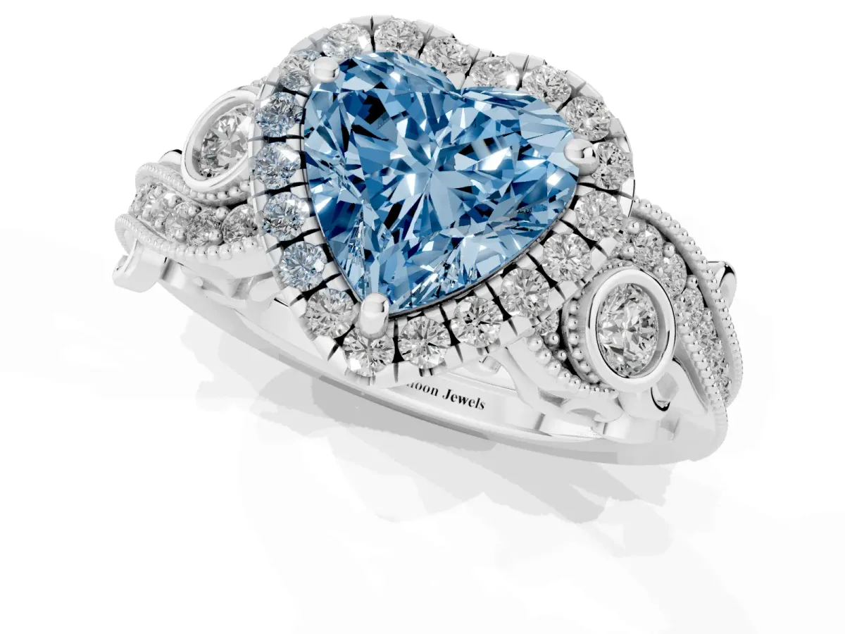 Fancy Blue Heart Cut Halo Diamond Ring with Milgrain and Bezel Accents on a Split Shank Band Platinum