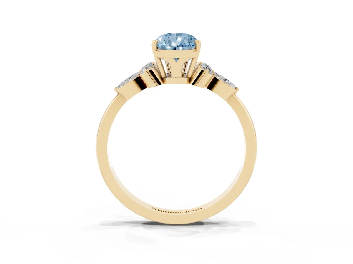 Fancy Blue Pear Cut Brilliant Diamond Solitaire Ring with Pear Side Stones and Four-Prong Setting Yellow gold