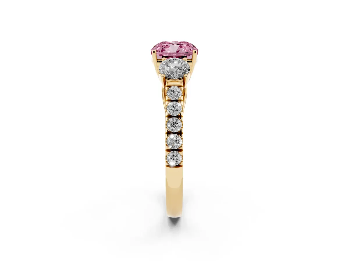 Fancy Pink Cushion Cut Cut Diamond Three-Stone Ring with Round Side Stones and Pavé Band Yellow gold