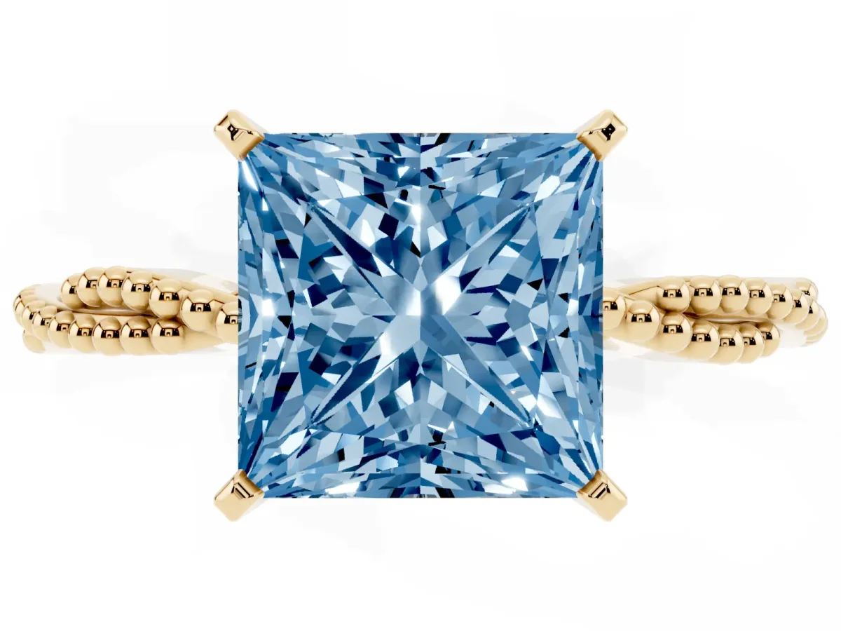 Fancy Blue Princess Cut Solitaire Twisted Band with Bead Prong Setting Yellow gold