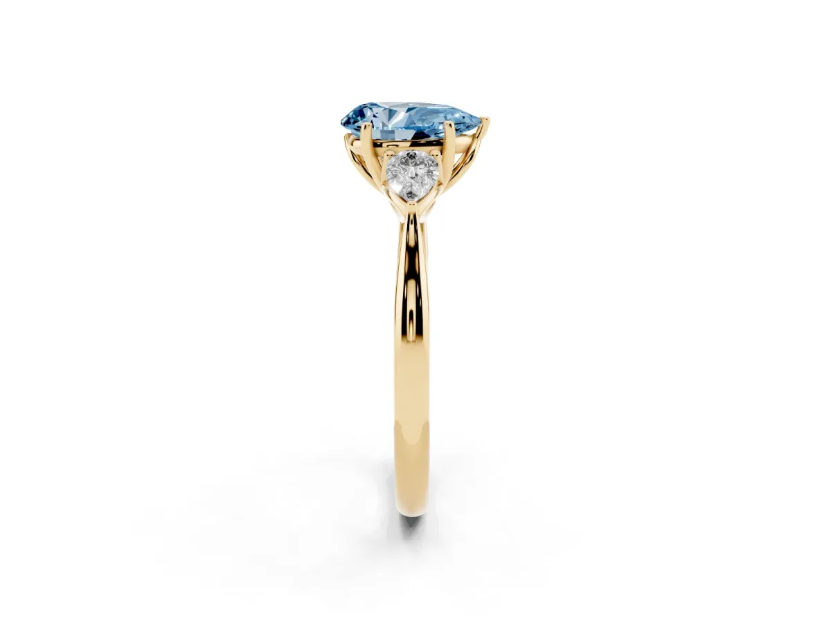 Fancy Blue Pear Cut Diamond Three-Stone Ring with Pear Side Stones and Prong Setting Yellow gold