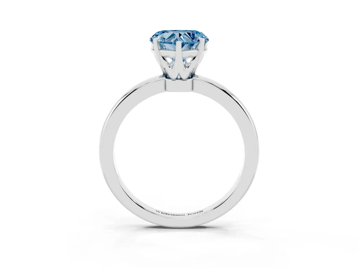 Fancy Blue Heart Cut Solitaire Diamond Ring with Six-Prong Setting on a Classic Band Platinum
