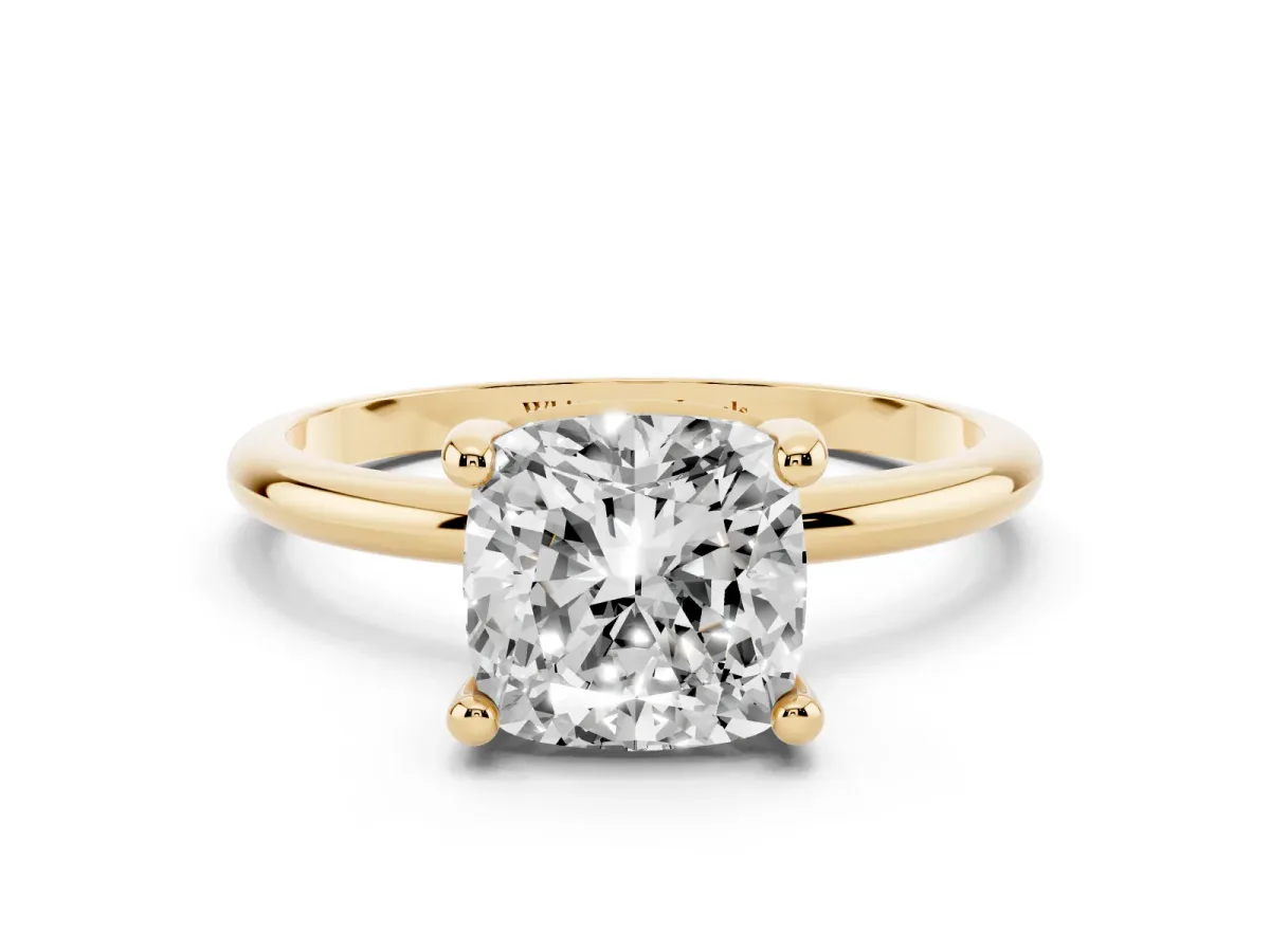 Cushion Cut Solitaire Diamond Ring with 4-Prong Setting on a Classic Band Yellow gold