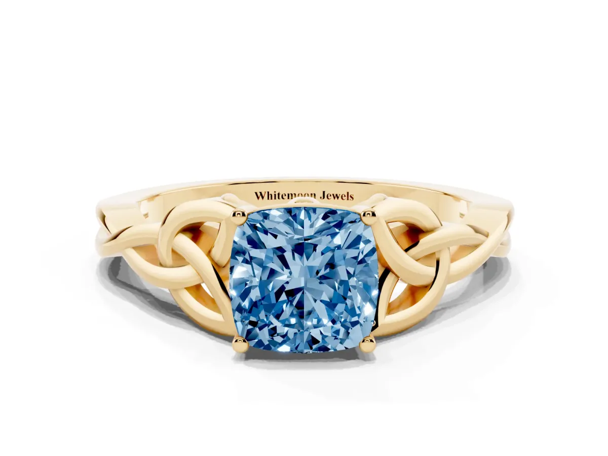 Fancy Blue Cushion Cut Diamond Solitaire Engagement Ring with Celtic Knot Band and Four-Prong Setting Yellow gold