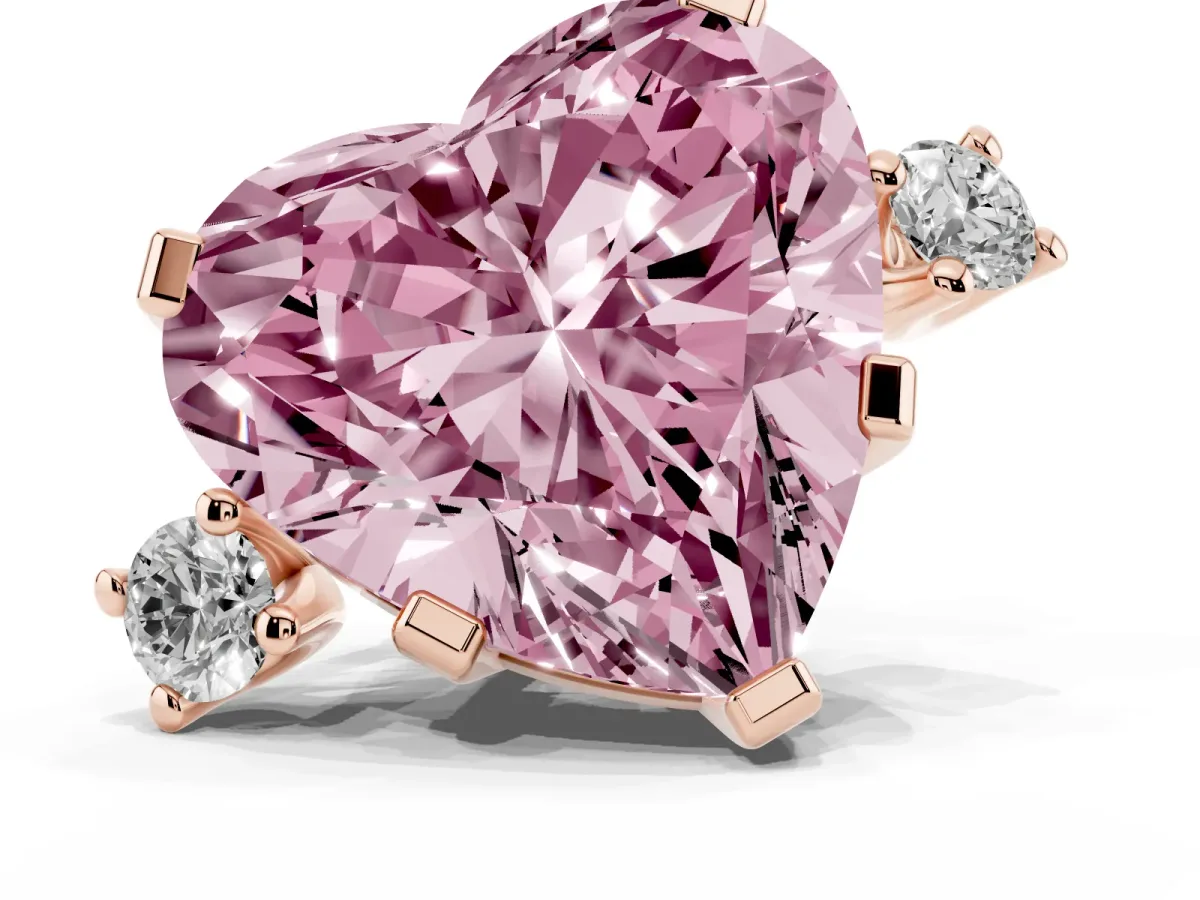 Fancy Pink Heart Cut Cut Three-Stone Solitaire Ring with Round Accent Diamonds and Four-Prong Setting Rose gold