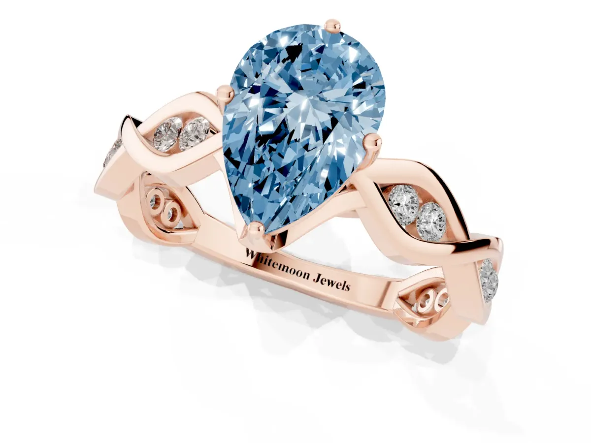 Fancy Blue Pear Cut Solitaire Twist Band with Leaf Prong Setting Rose gold