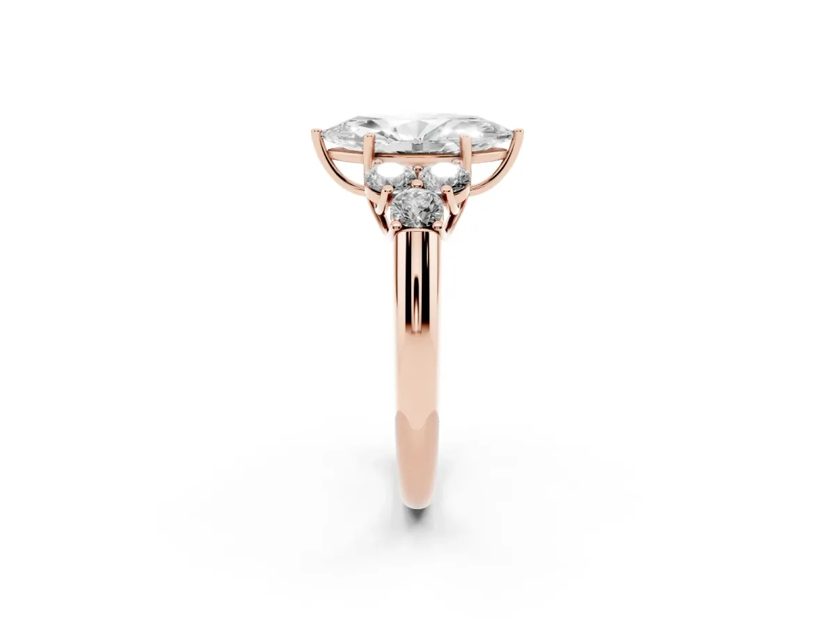 Marquise Cut Cut Diamond Cluster Ring with Round Accent Stones and Prong Setting on a Classic Band Rose gold