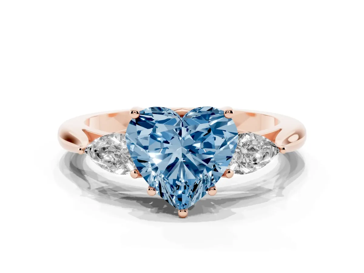 Fancy Blue Heart Cut Diamond Three-Stone Ring with Pear Side Stones and Prong Setting Rose gold