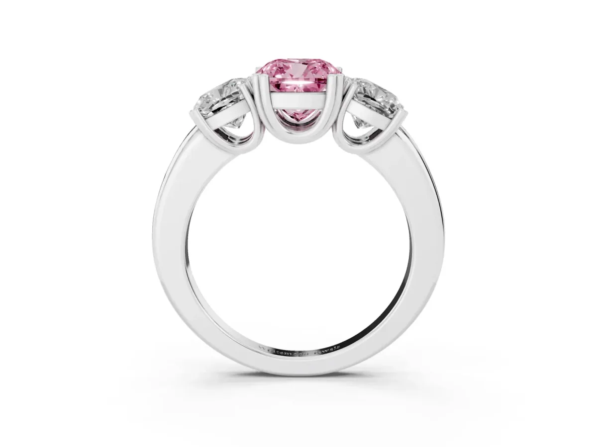 Fancy Pink Three-Stone Cushion Cut Cut Diamond Ring with Channel Set Band and Four-Prong Setting Platinum