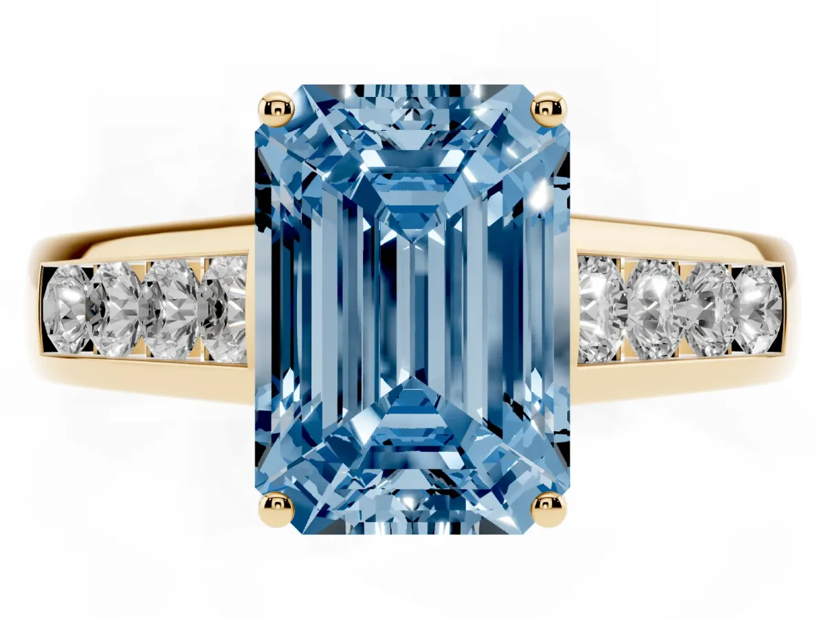 Fancy Blue Emerald Cut Brilliant Channel-Set Solitaire Ring with Four-Prong Setting Yellow gold