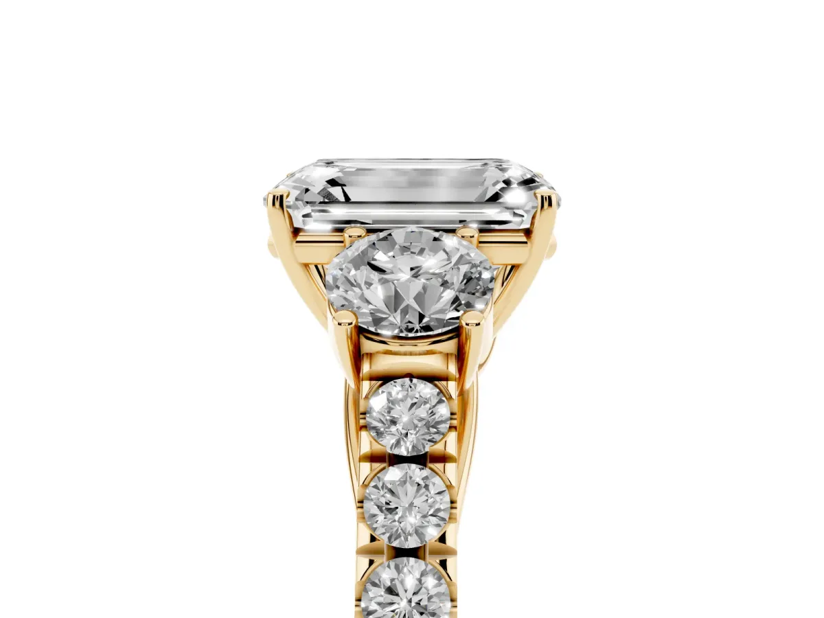 Emerald Cut Cut Diamond Three-Stone Ring with Round Side Stones and Pavé Band Yellow gold