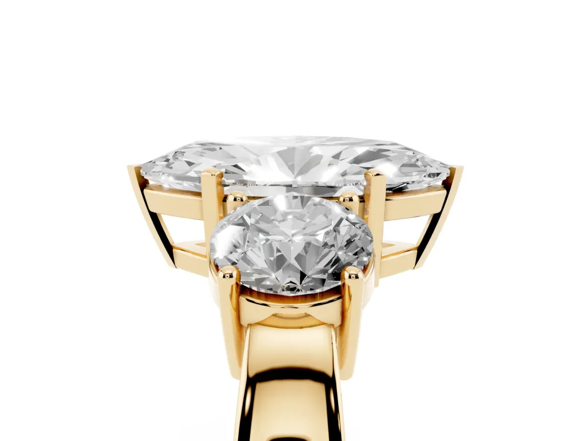 Three-Stone Marquise Cut Diamond Ring with Round Side Stones, Classic Band, and Four-Prong Setting Yellow gold