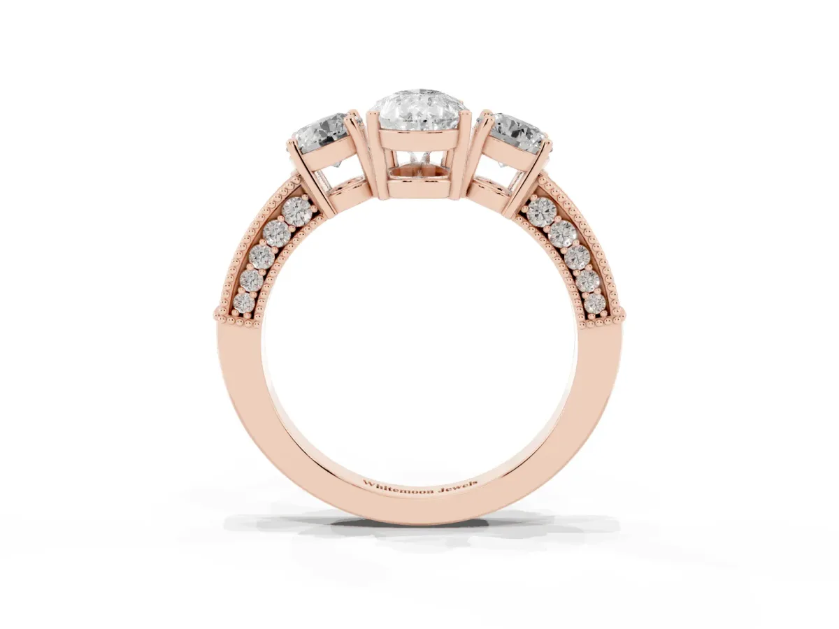 Pear Cut Three-Stone Diamond Ring with Pavé Band and Four-Prong Setting Rose gold