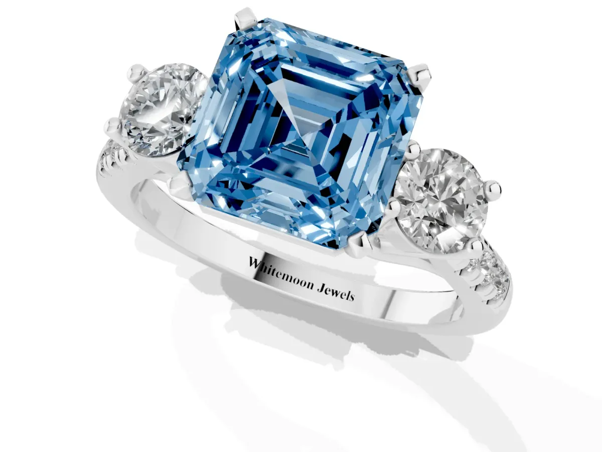 Fancy Blue Three-Stone Asscher Cut Diamond Pavé Band with Four-Prong Setting Platinum