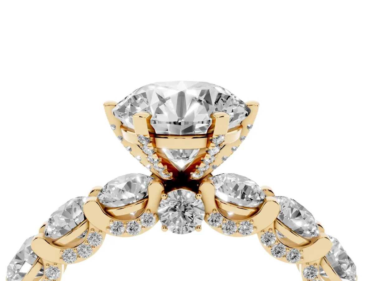 Round Cut Diamond Side Stone Engagement Ring with Four-Prong Setting Yellow gold