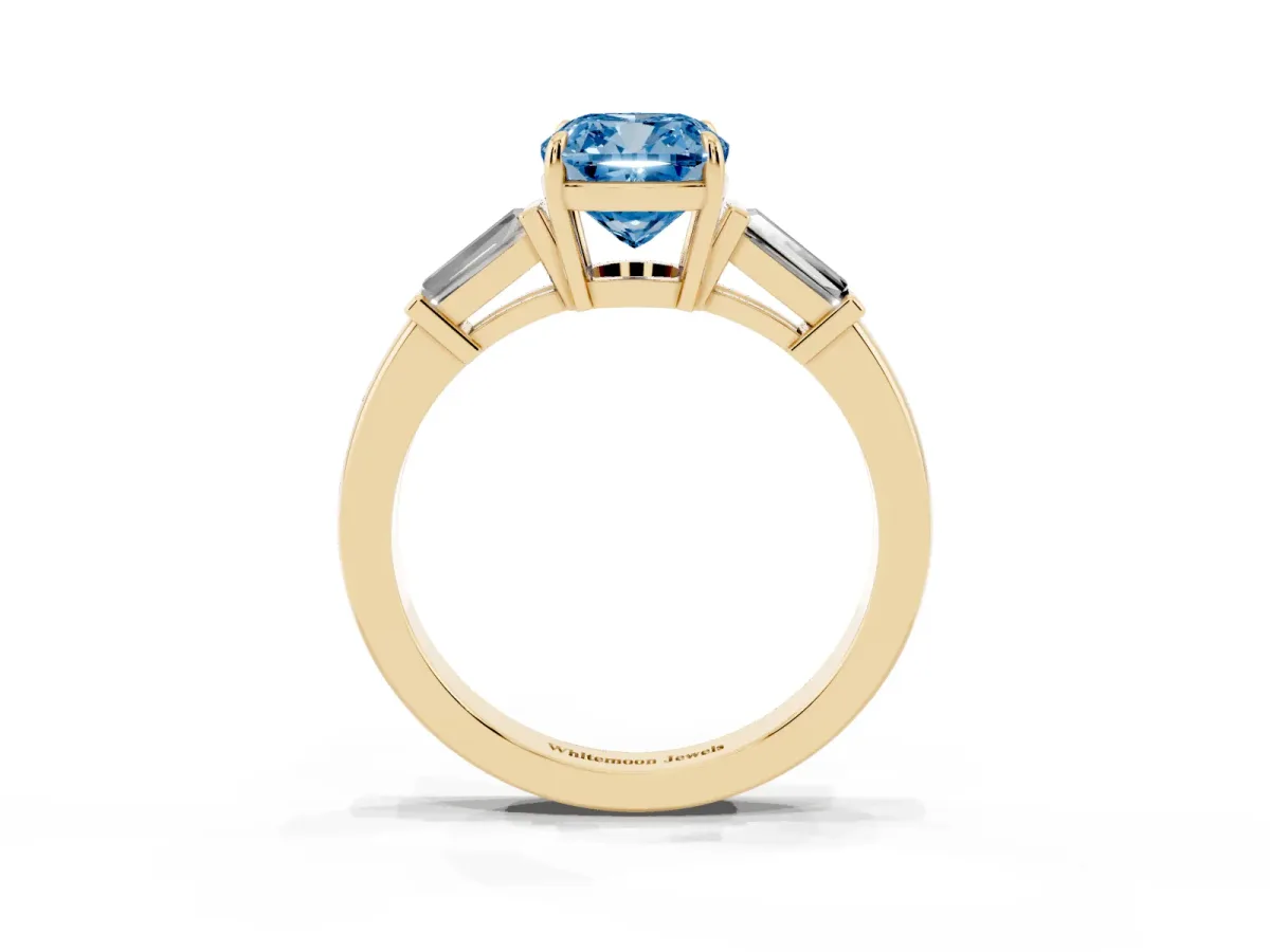 Fancy Blue Cushion Cut Diamond Three-Stone Ring with Tapered Baguette Side Stones and Prong Setting Yellow gold