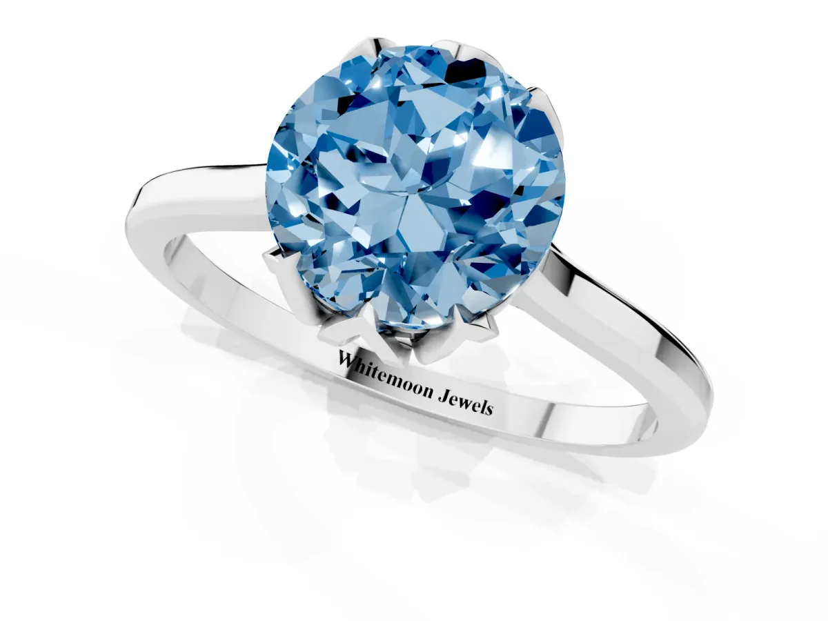 Fancy Blue Round Cut Diamond Solitaire Ring with Flower Prong Setting and Classic Band Silver