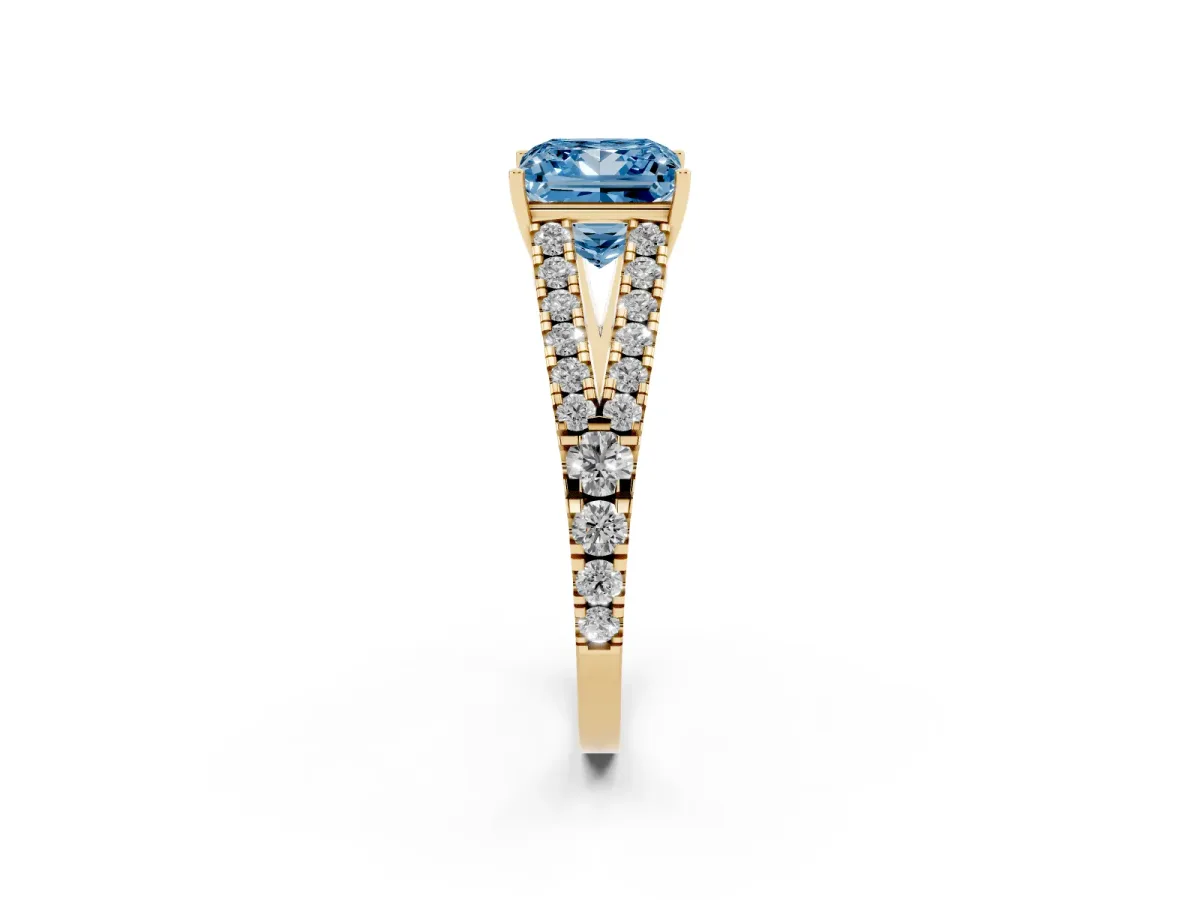 Fancy Blue Princess Cut Diamond Split Shank Pavé Engagement Ring with Four-Prong Setting Yellow gold