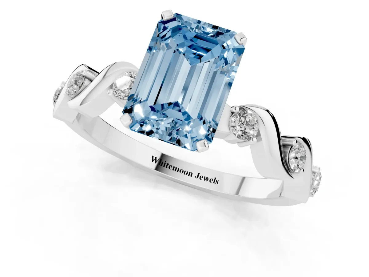 Fancy Blue Emerald Cut Diamond Solitaire Twisted Band with Round Accents and Prong Setting Platinum
