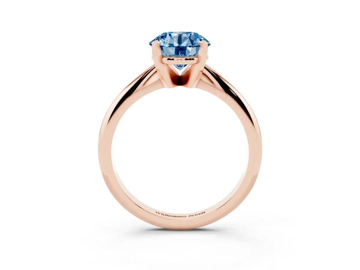 Fancy Blue Round Cut Cut Solitaire Ring with Four-Prong Setting on a Classic Band Rose gold