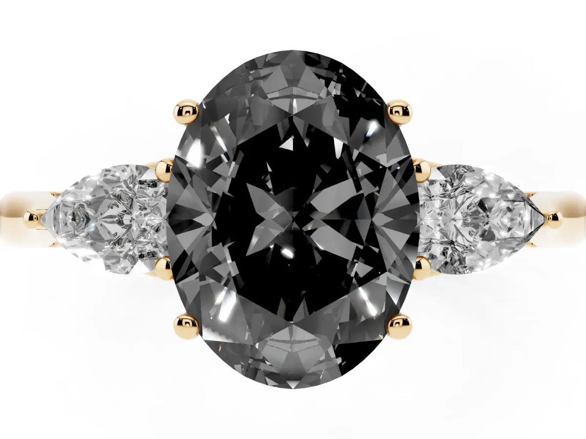 Fancy Black Oval Cut Diamond Three-Stone Ring with Pear Side Stones and Prong Setting Yellow gold