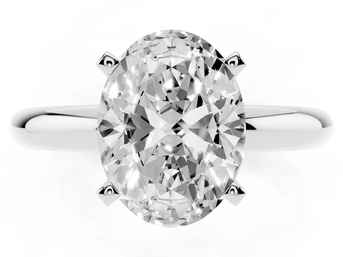 Oval Cut Diamond Solitaire Engagement Ring with Round Band and Four-Prong Setting Platinum