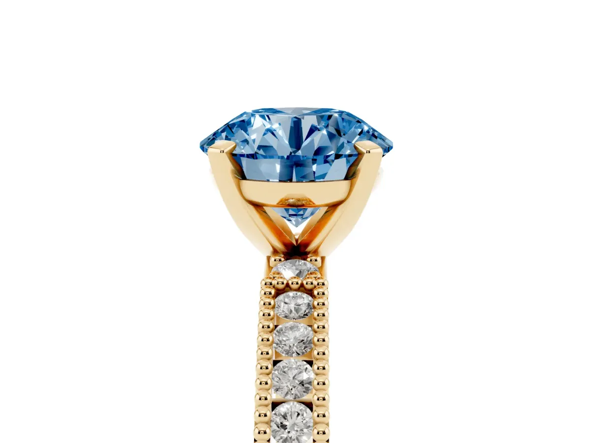 Fancy Blue Round Cut Solitaire with Pavé Band and Four-Prong Setting Yellow gold