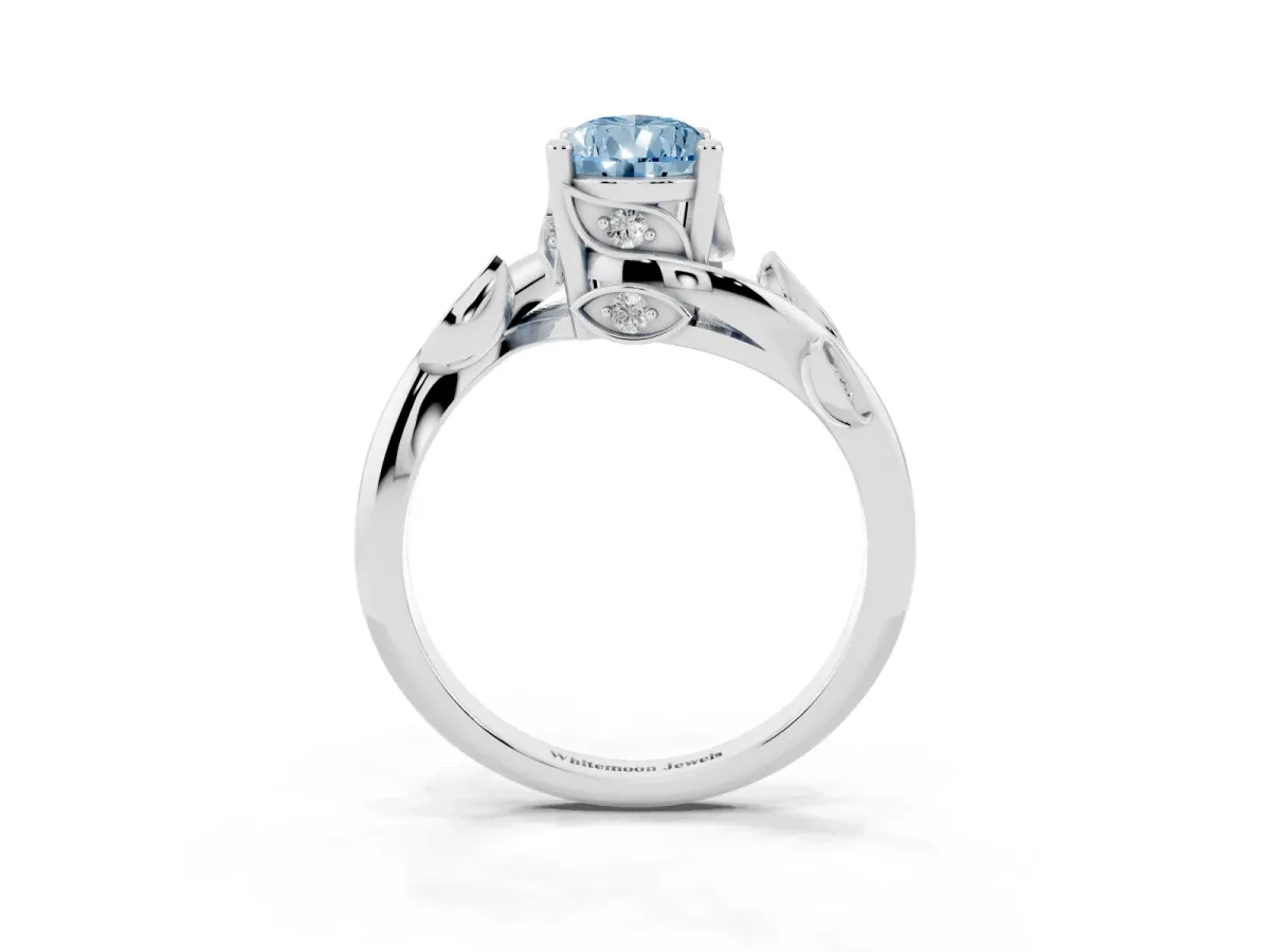 Fancy Blue Pear Cut Solitaire Twist Engagement Ring with Leaf Accents and Prong Setting Silver