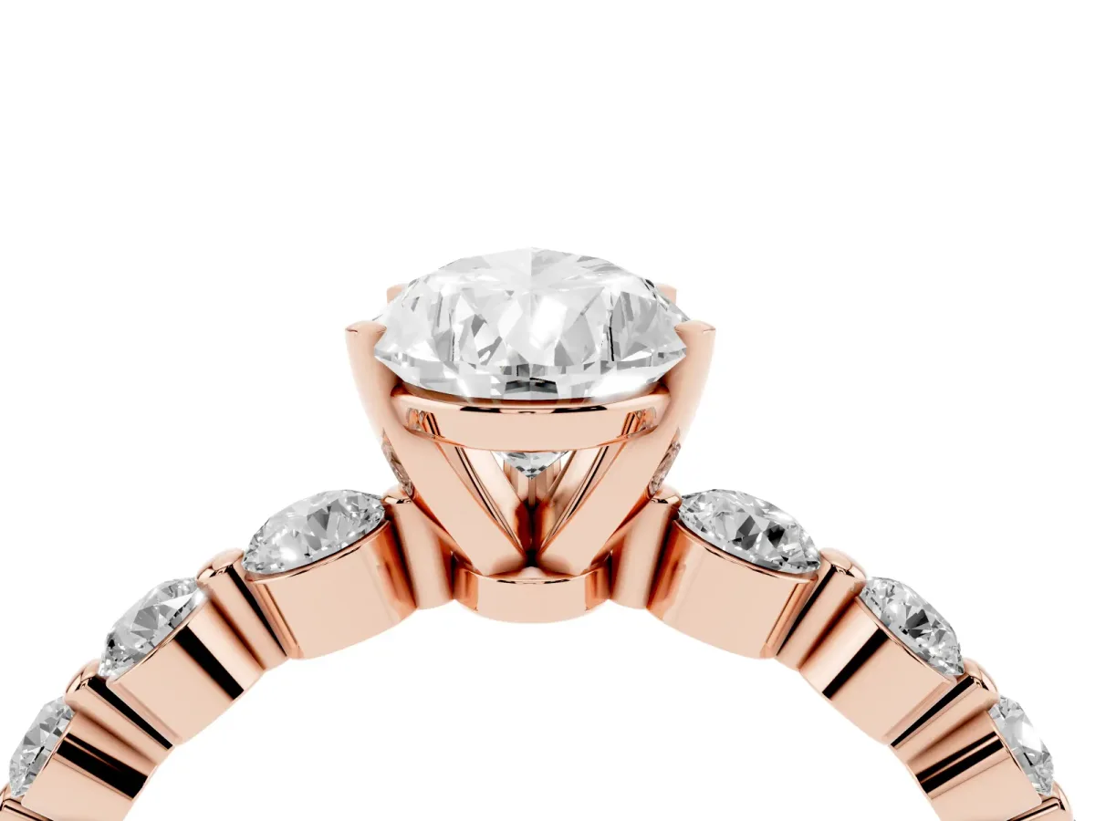 Pear Cut Solitaire Diamond Ring with Pave Band and Four-Prong Setting Rose gold