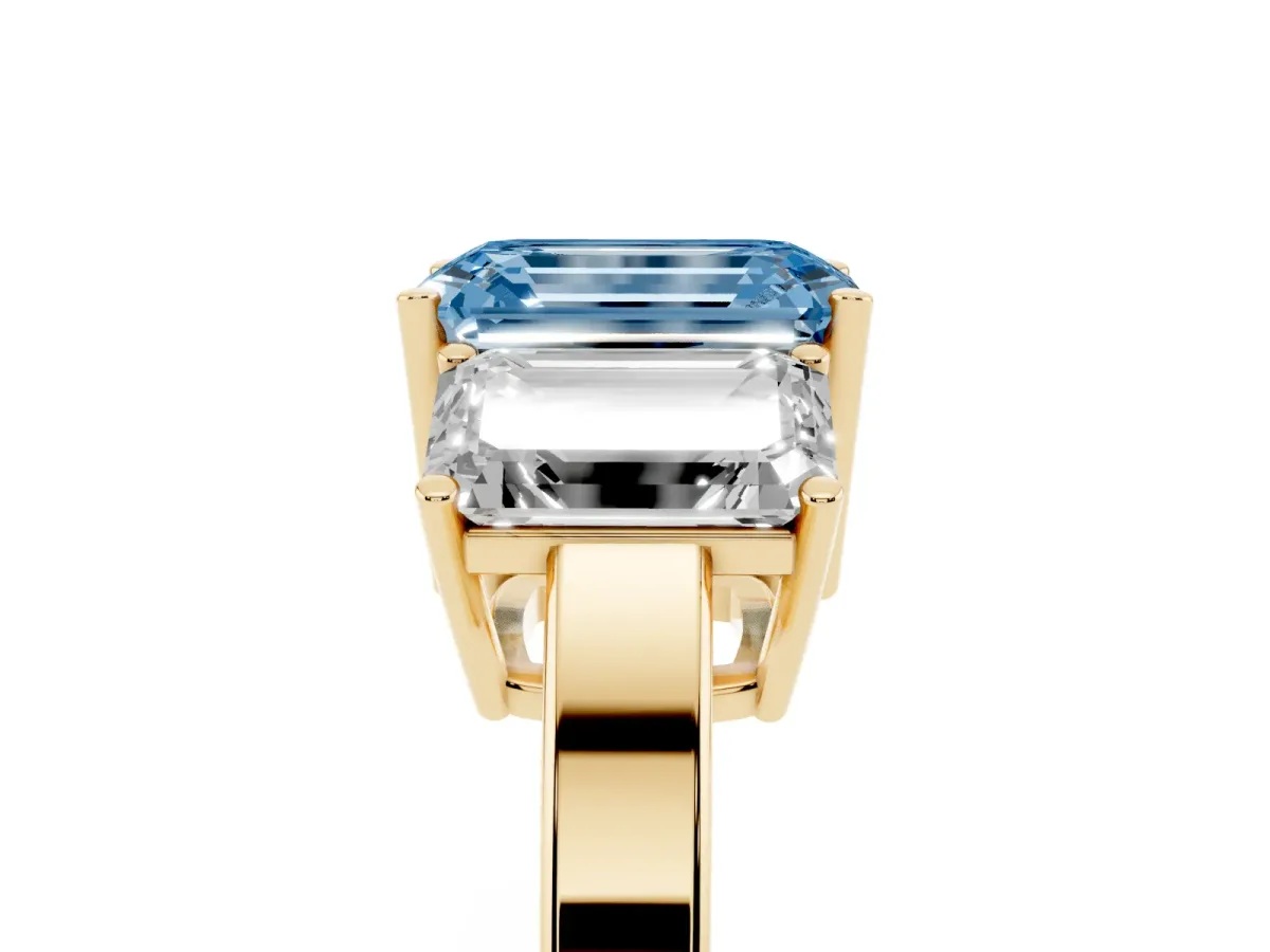 Fancy Blue Three-Stone Emerald Cut Cut Diamond Engagement Ring with Flat Band and Four-Prong Setting Yellow gold