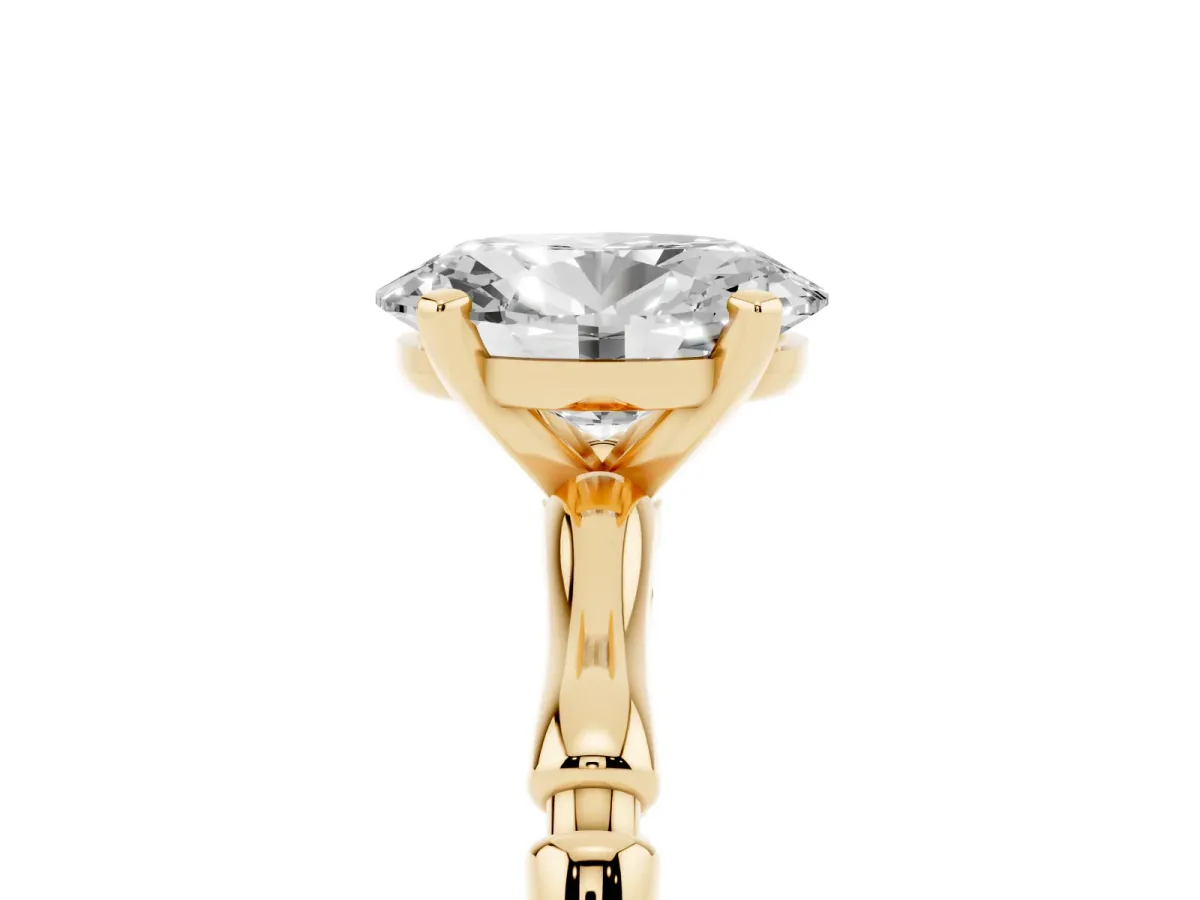 Oval Cut Solitaire Diamond Ring with Bamboo Band and Four-Prong Setting Yellow gold