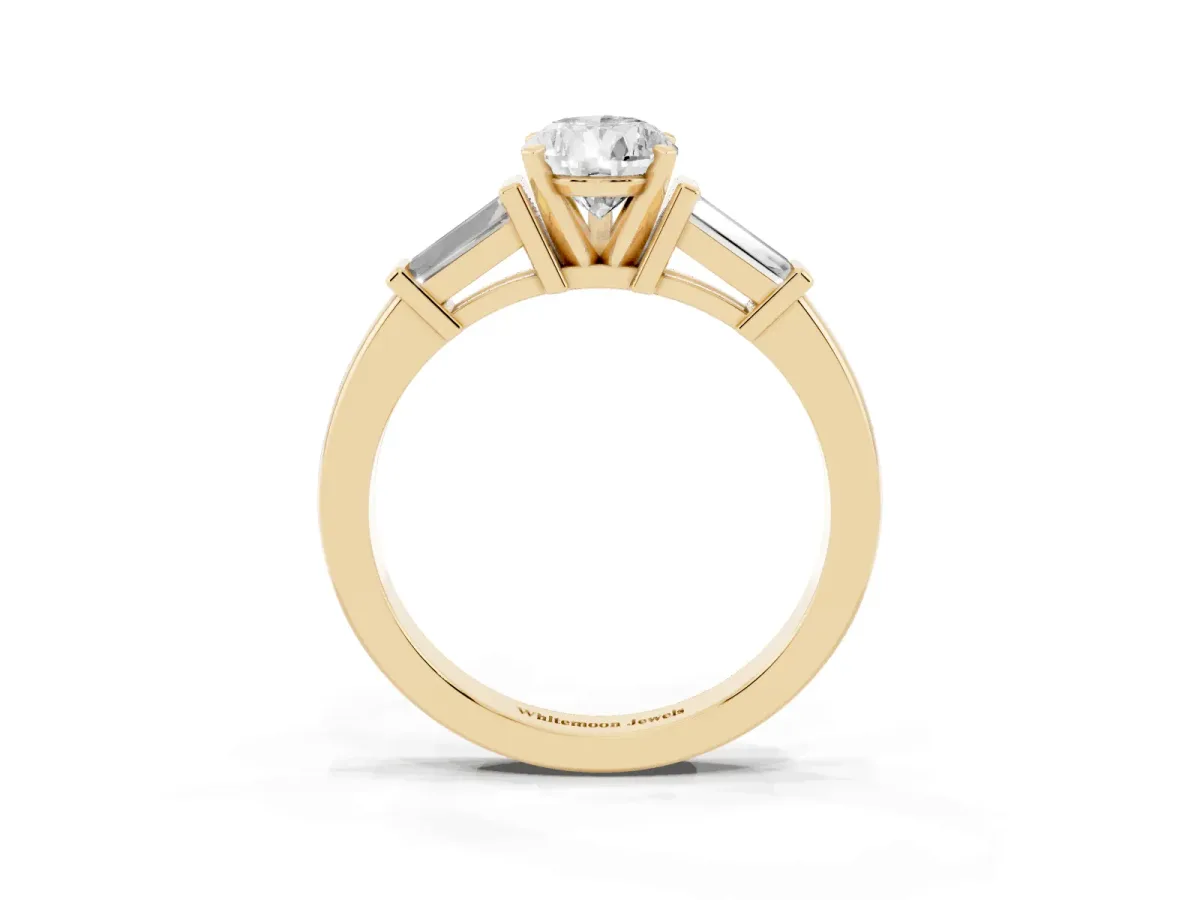 Pear Cut Cut Diamond Solitaire Ring with Tapered Baguette Accents and Four-Prong Setting Yellow gold