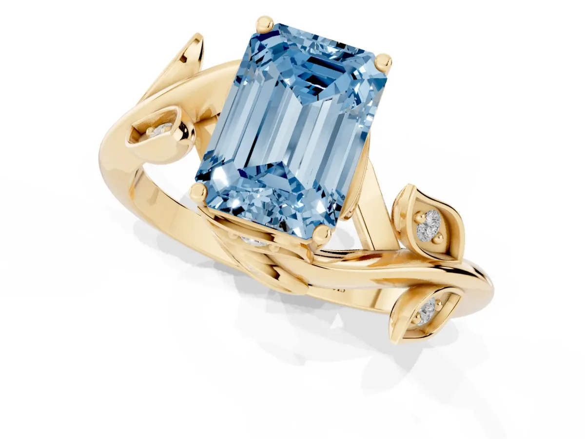 Fancy Blue Emerald Cut Solitaire Twist Engagement Ring with Leaf Accents and Prong Setting Yellow gold