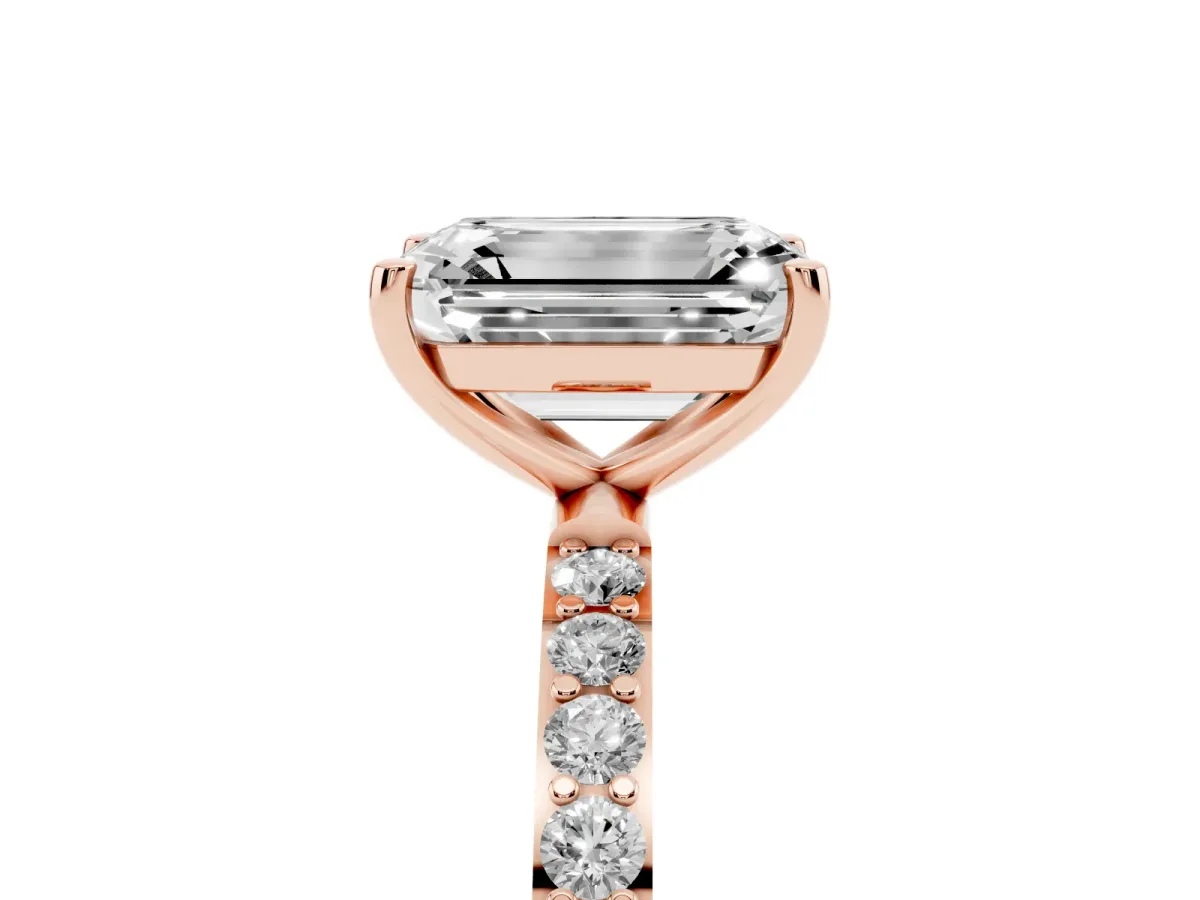 Emerald Cut Diamond Solitaire Ring with Round Pavé Shoulders and Prong Setting Rose gold