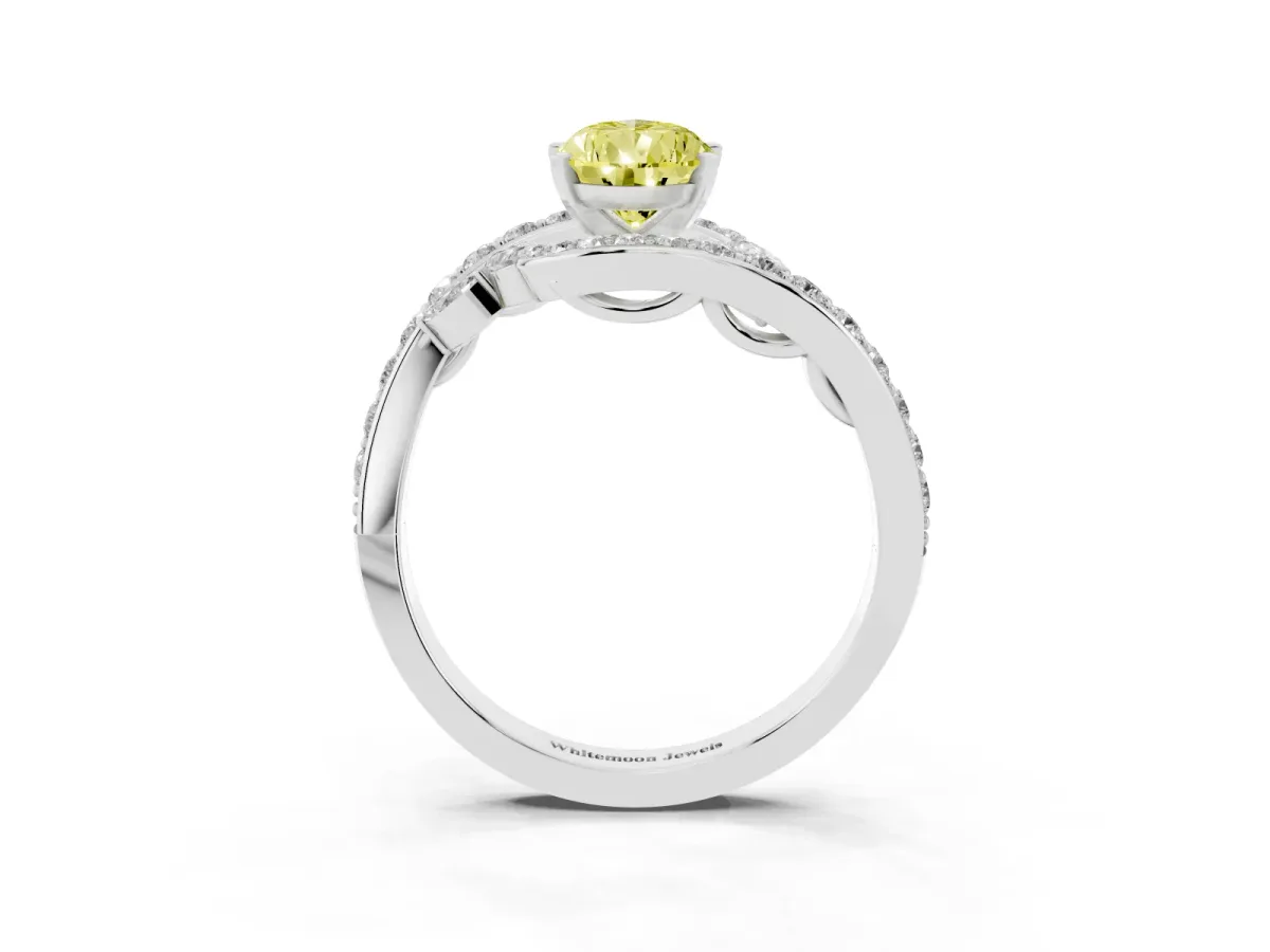 Fancy Yellow Pear Cut Solitaire with Pavé Twist Band and Four-Prong Setting Silver