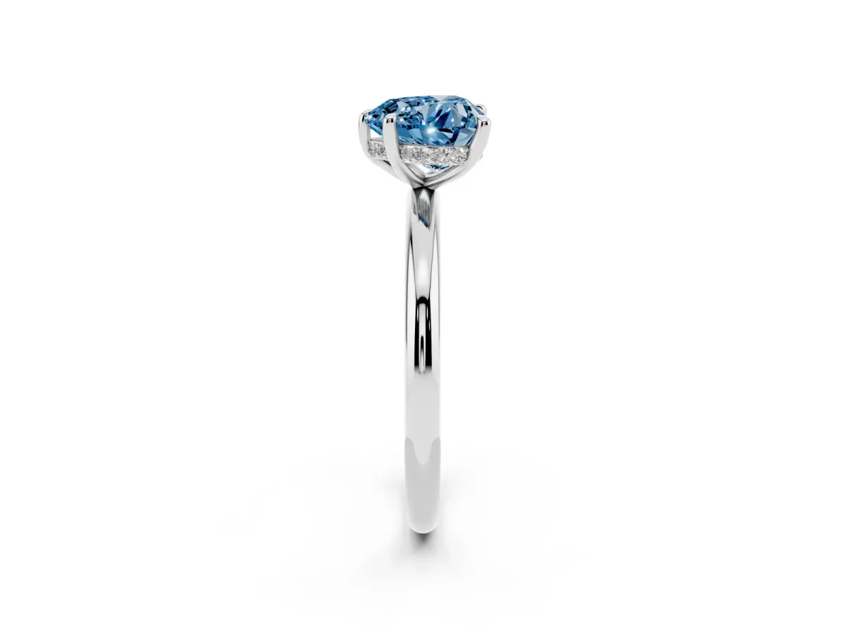 Fancy Blue Heart Cut Diamond Solitaire Ring with Thin Band and Four-Prong Setting Silver