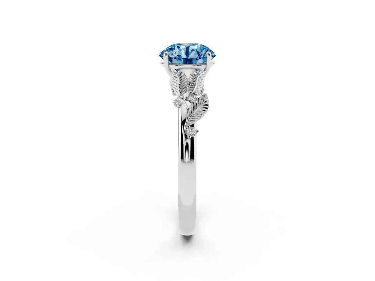 Fancy Blue Round Cut Diamond Solitaire Ring with Leaf Motif Band and Four-Prong Setting Silver