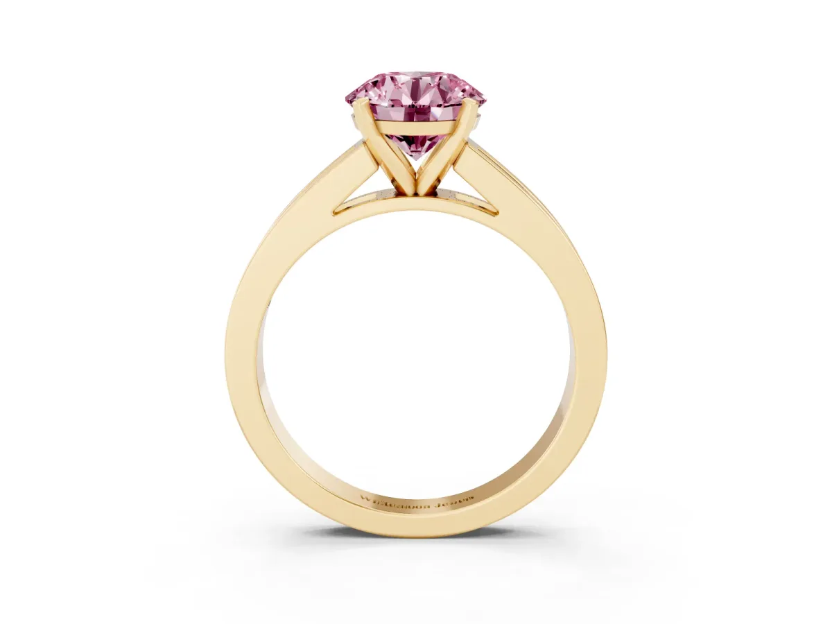 Fancy Pink Round Cut Solitaire Diamond Ring with Channel-Set Band and Four-Prong Setting Yellow gold