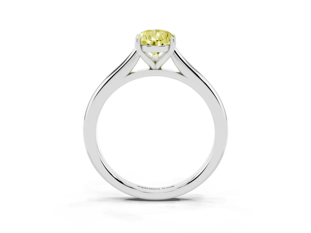Fancy Yellow Pear Cut Cut Solitaire Ring with Cathedral Band and Four-Prong Setting Silver