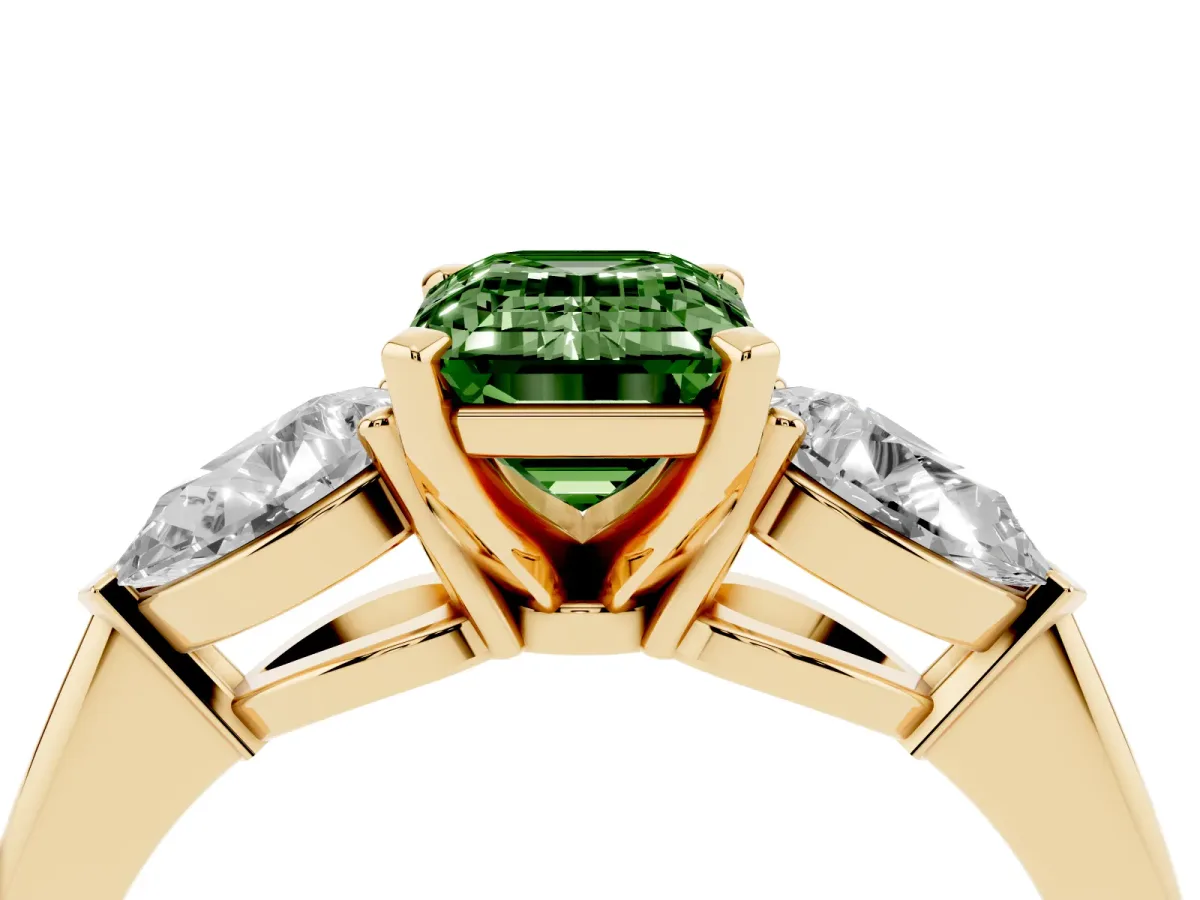 Fancy Green Three-Stone Emerald Cut Diamond Ring with Pear Side Stones and Four-Prong Setting Yellow gold