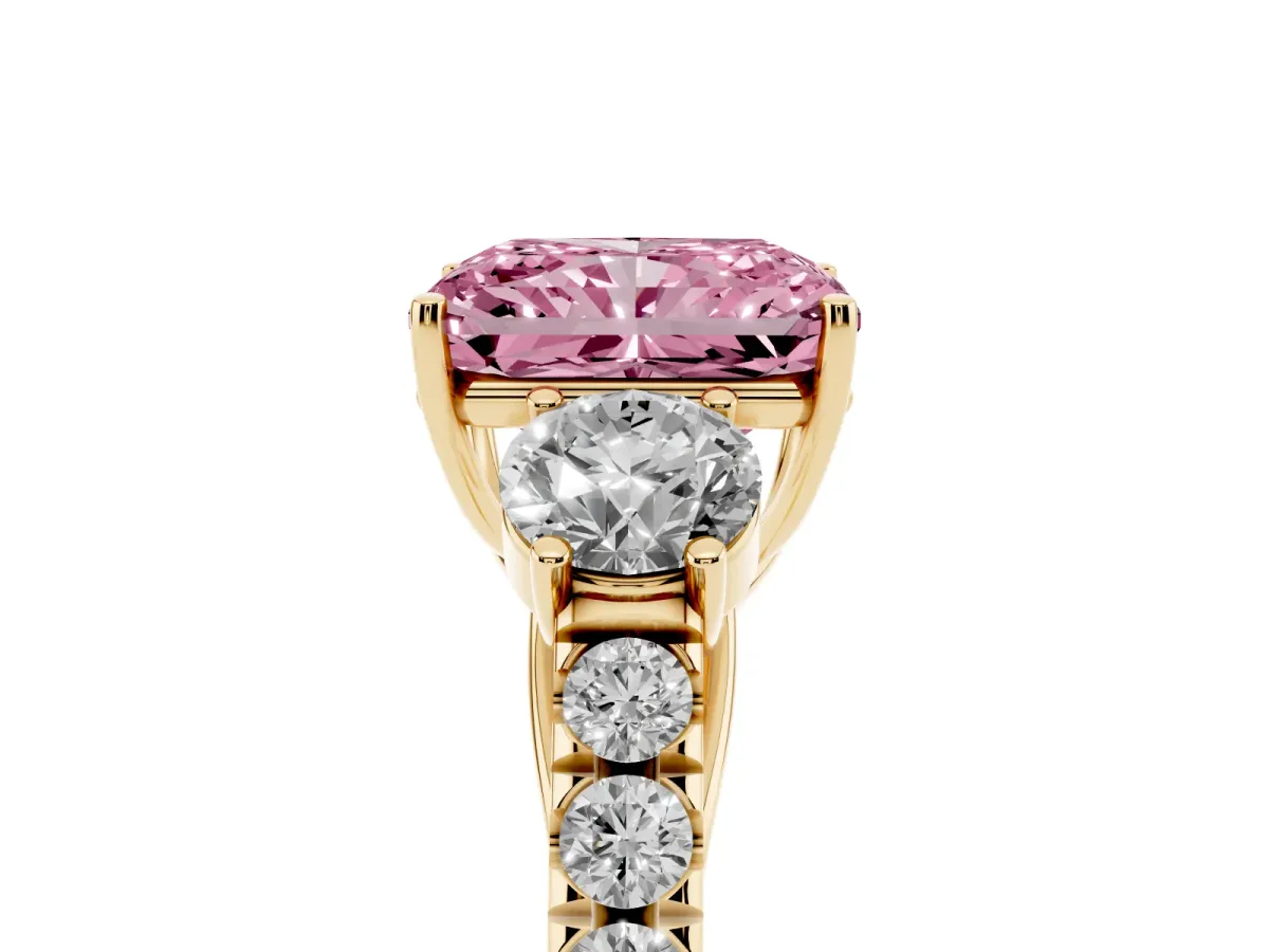Fancy Pink Radiant Cut Cut Diamond Three-Stone Ring with Round Side Stones and Pavé Band Yellow gold