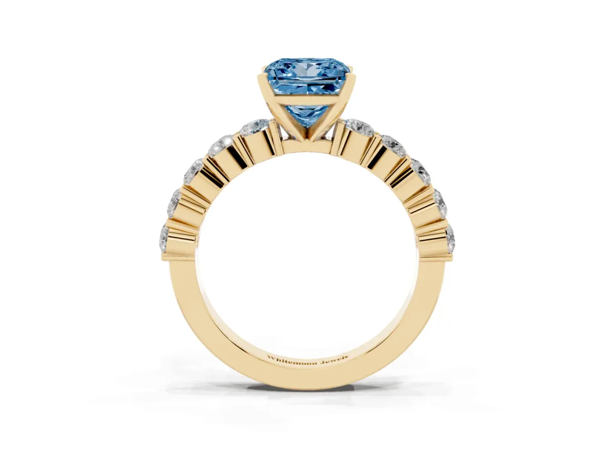 Fancy Blue Princess Cut Diamond Solitaire Ring with Shared Prong Round Side Stones Yellow gold