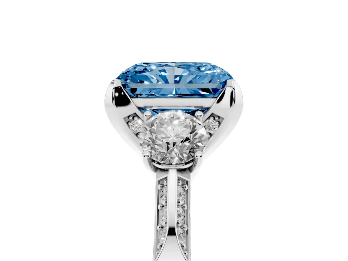 Fancy Blue Radiant Cut Brilliant Three-Stone Diamond Ring with Pavé Band and Four-Prong Setting Silver