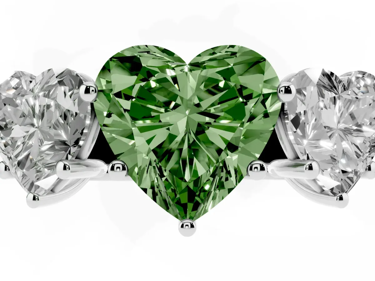 Fancy Green Heart Cut Three-Stone Diamond Ring with Prong Setting on a Classic Band Silver